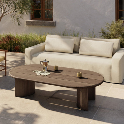 Four Hands Paden Outdoor Coffee Table Stained Toasted Brown Staged View