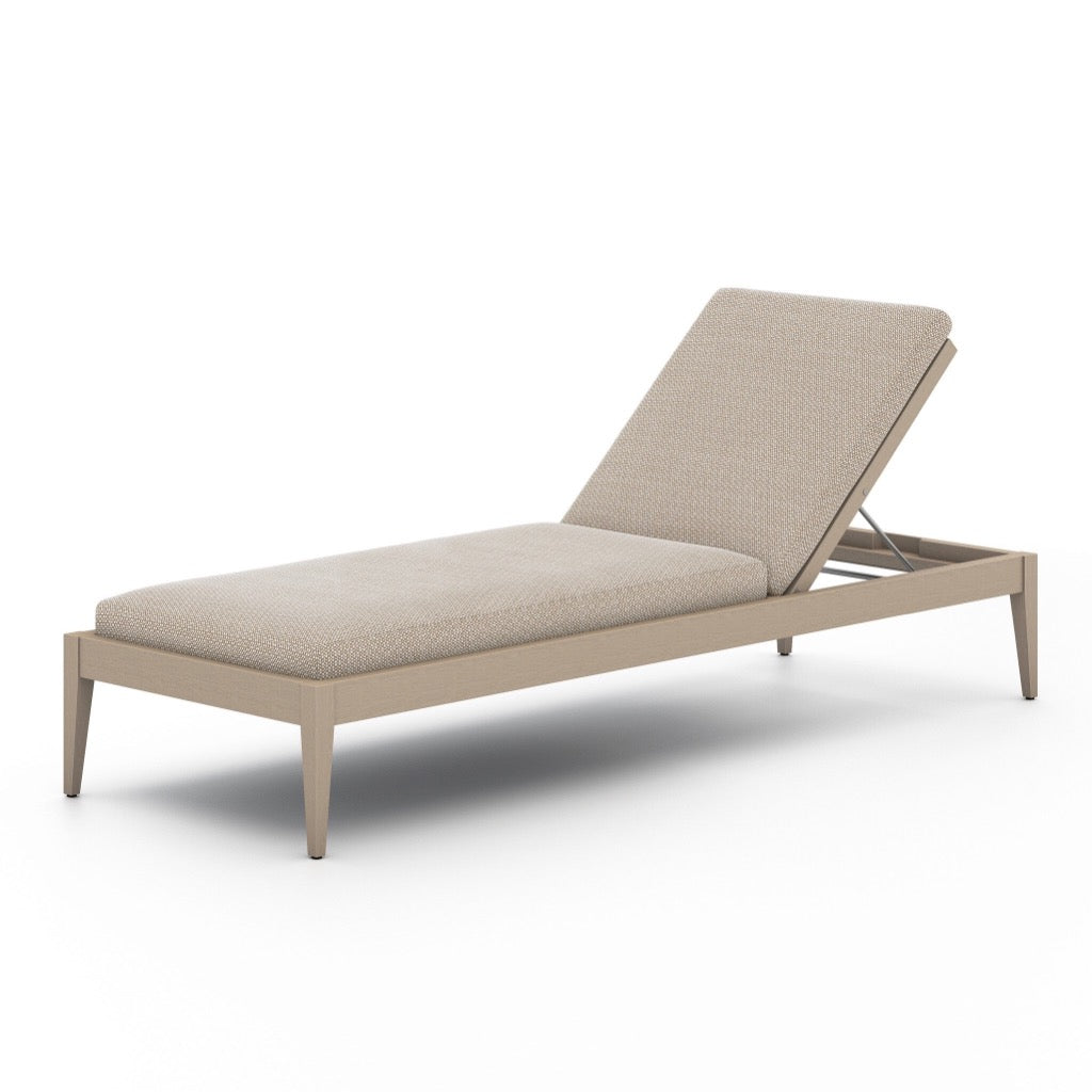 Sherwood Outdoor Chaise Faye Sand Angled View Four Hands